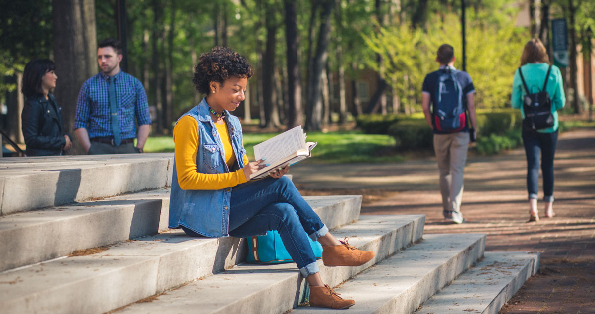 Students at Regent, a university that outlines award enrollment requirements.