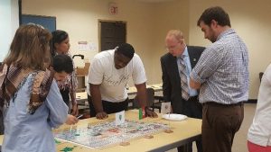 Regent University students participating in war game simulation