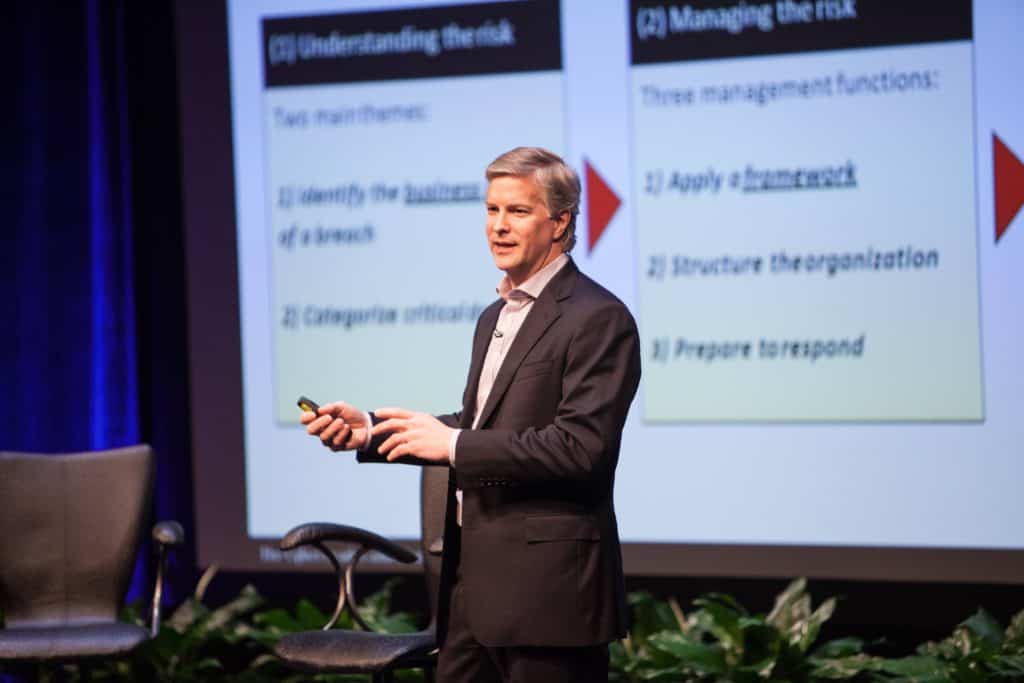 Cybersecurity expert presents a slide on risk management frameworks during Regent University’s Cybersecurity Summit.