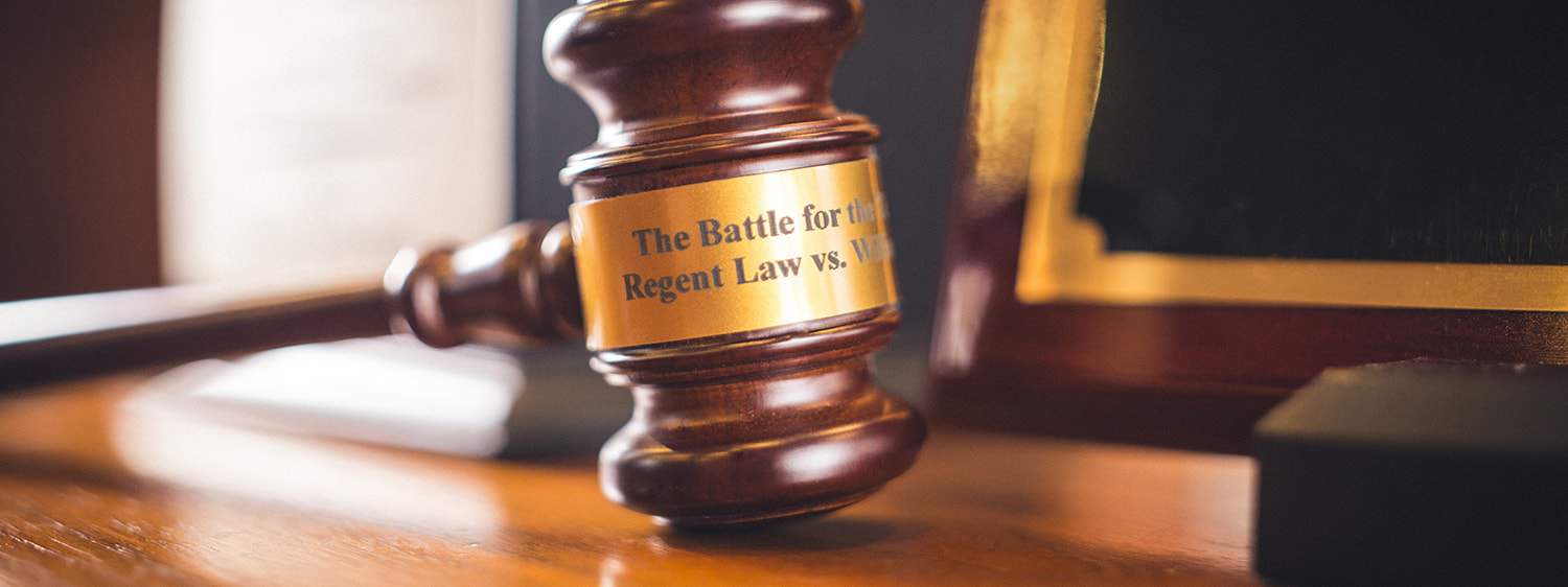 A brown gavel on a table at Regent University Law.