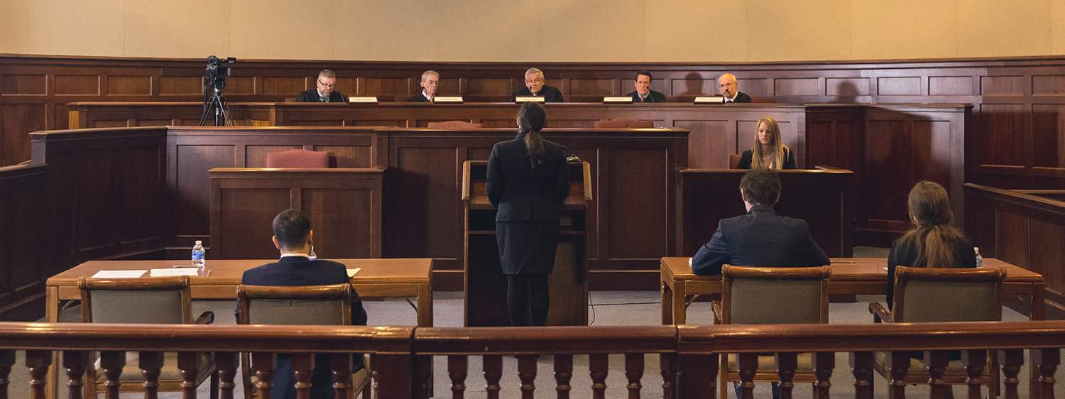 Students at a moot court: Pursue an MA in Law degree with a concentration in General Legal Studies at Regent University.