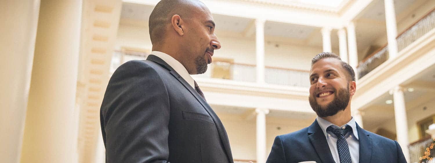 Two graduate students in Robertson School of Government building at Regent University Law School.