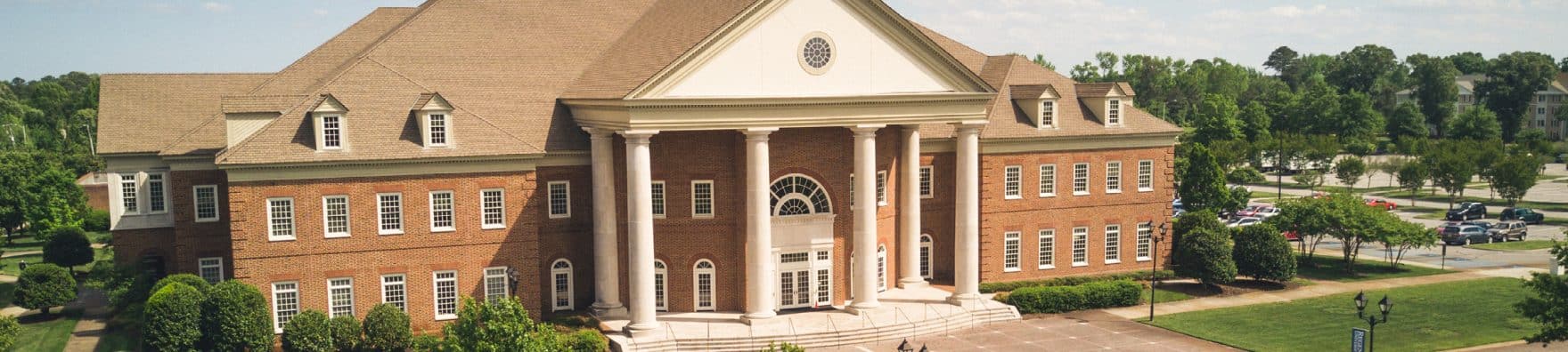 A closeup of a student praying in the chapel at Regent University in Virginia Beach, VA.