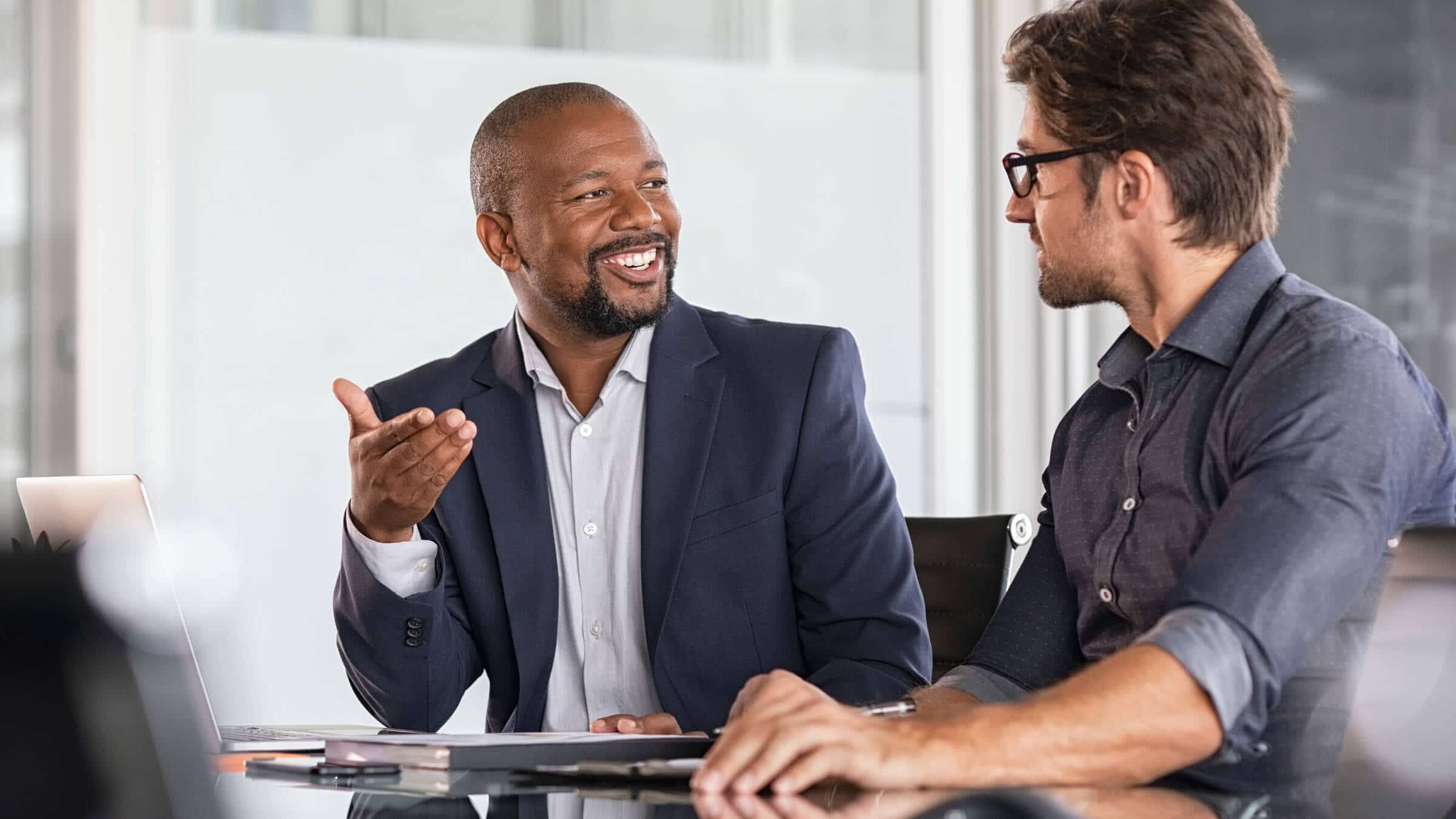 Two employees talking at work.