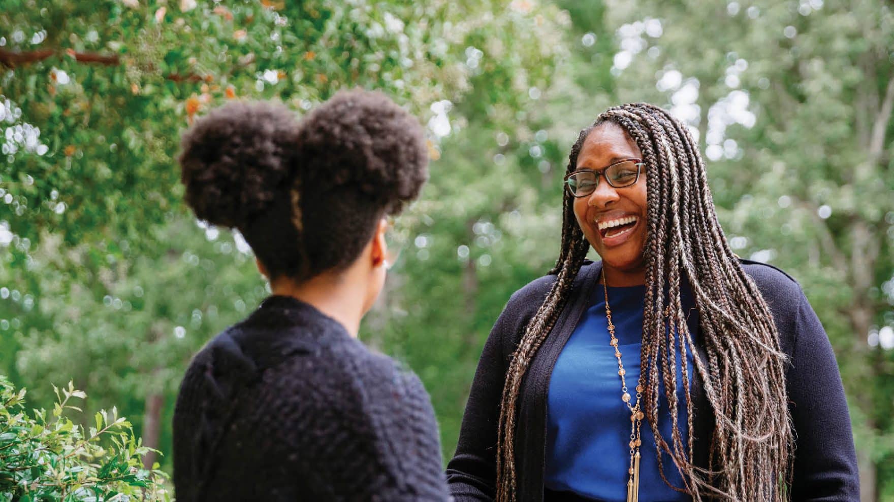 A counselor with a student: Learn about life coaching at Regent University.