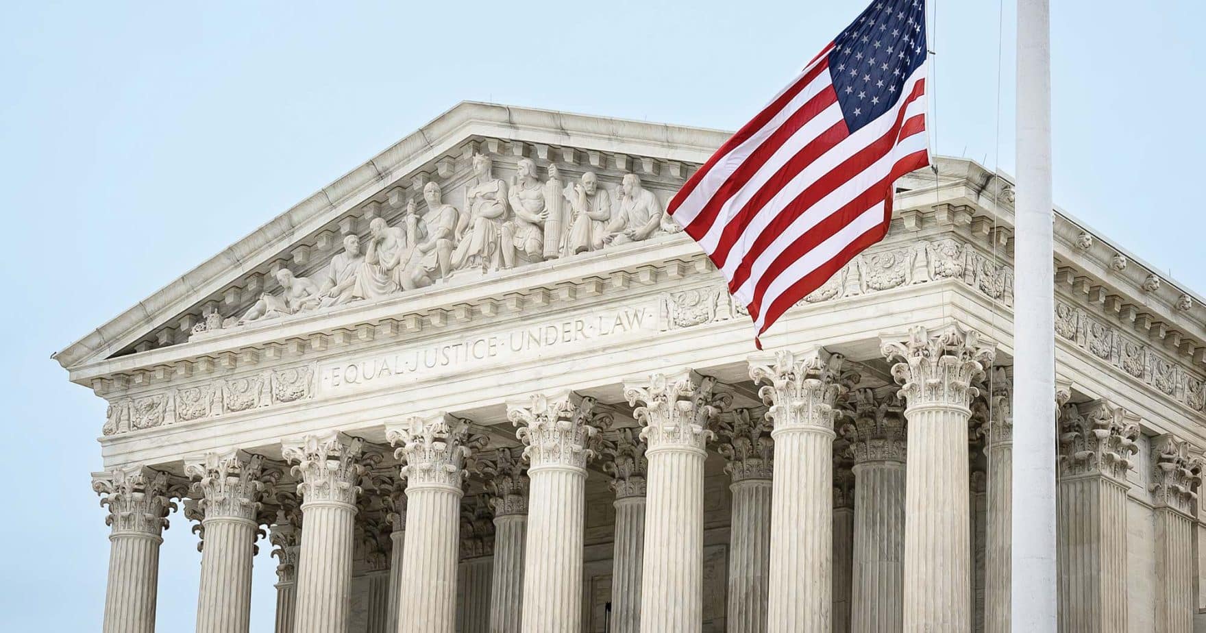 The American flag in front of the U.S. Supreme Court: Learn about the Robertson Center for Constitutional Law.