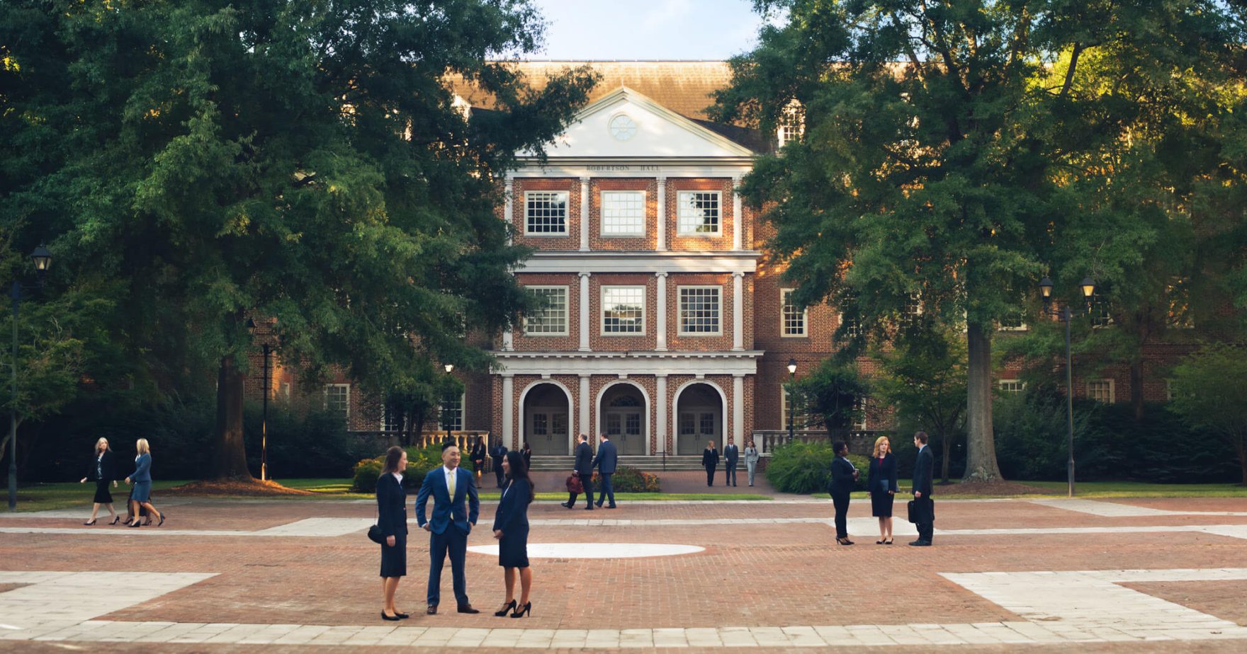 Regent University Students talking on campus: Read more about how the Regent University School of Law Earned High Marks in preLaw Magazine’s Back to School 2023 Issue