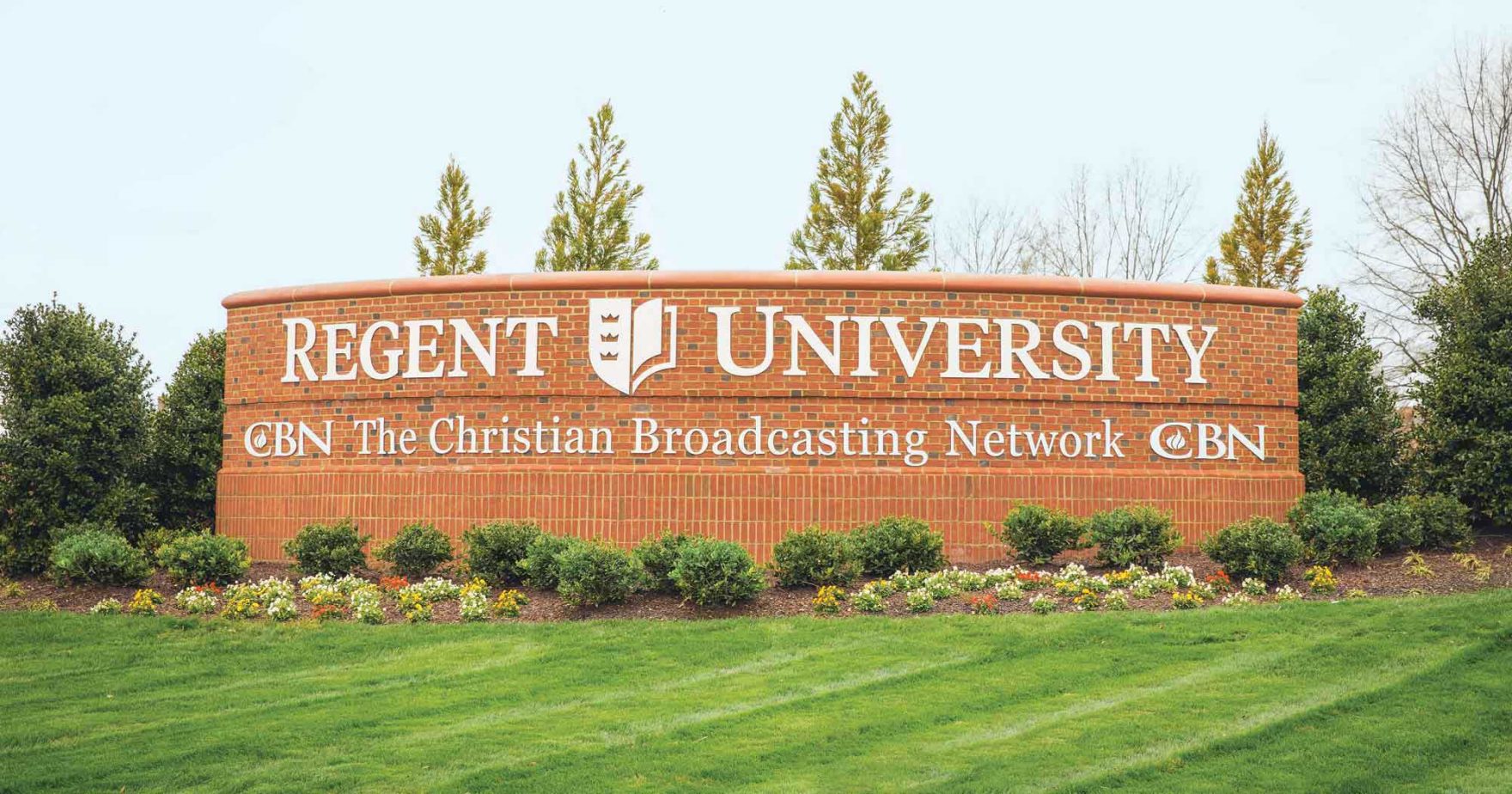 Regent sign located on campus in Virginia Beach, VA 23464: Explore Regent University online and on-campus programs.