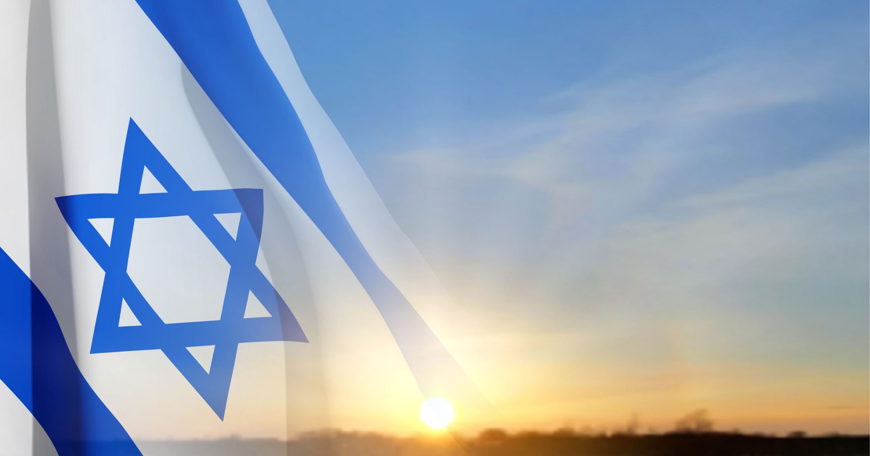 A photo of Israel's national flag crossfaded with a sunrise: Learn more about Regent University’s Statement on Antisemitism