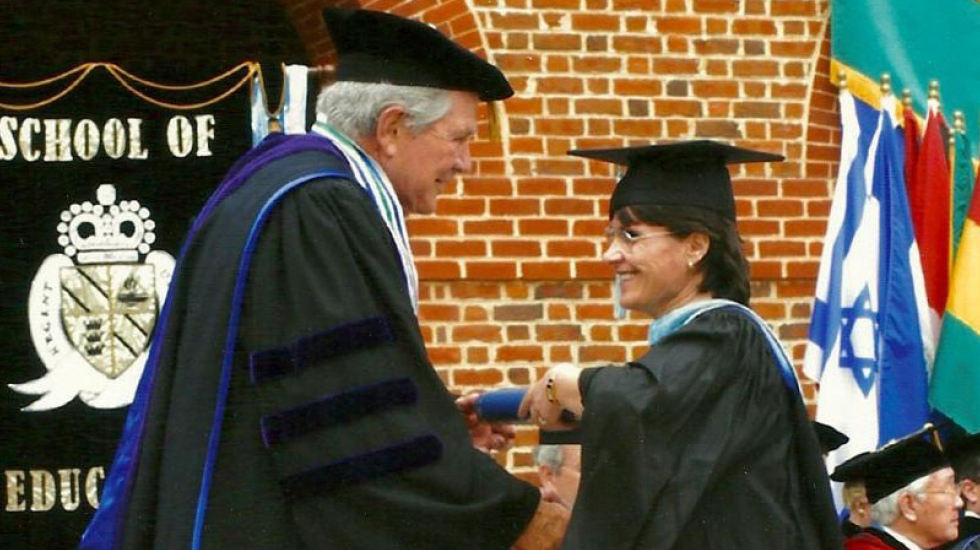 Klementina Shahini receives her master's degree in educational leadership from Chancellor Pat Robertson in 2003.