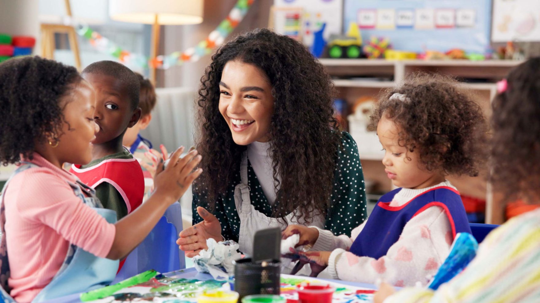 Teacher working with students.
