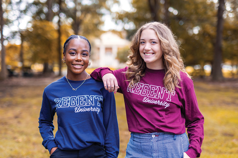 Regent University students on campus wearing Regent t-shirts.