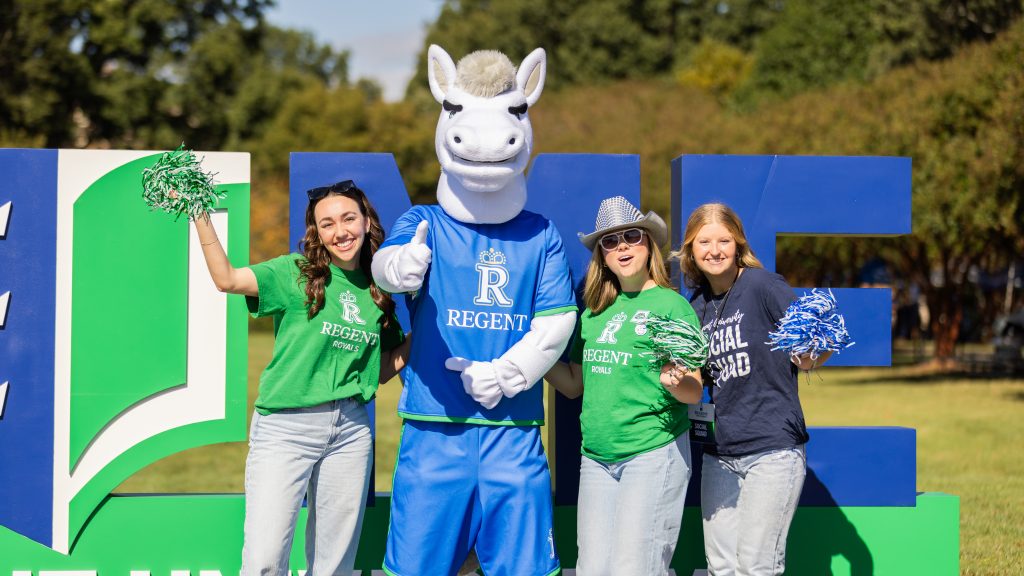 Students cheering at Royals Fest on the Regent University campus