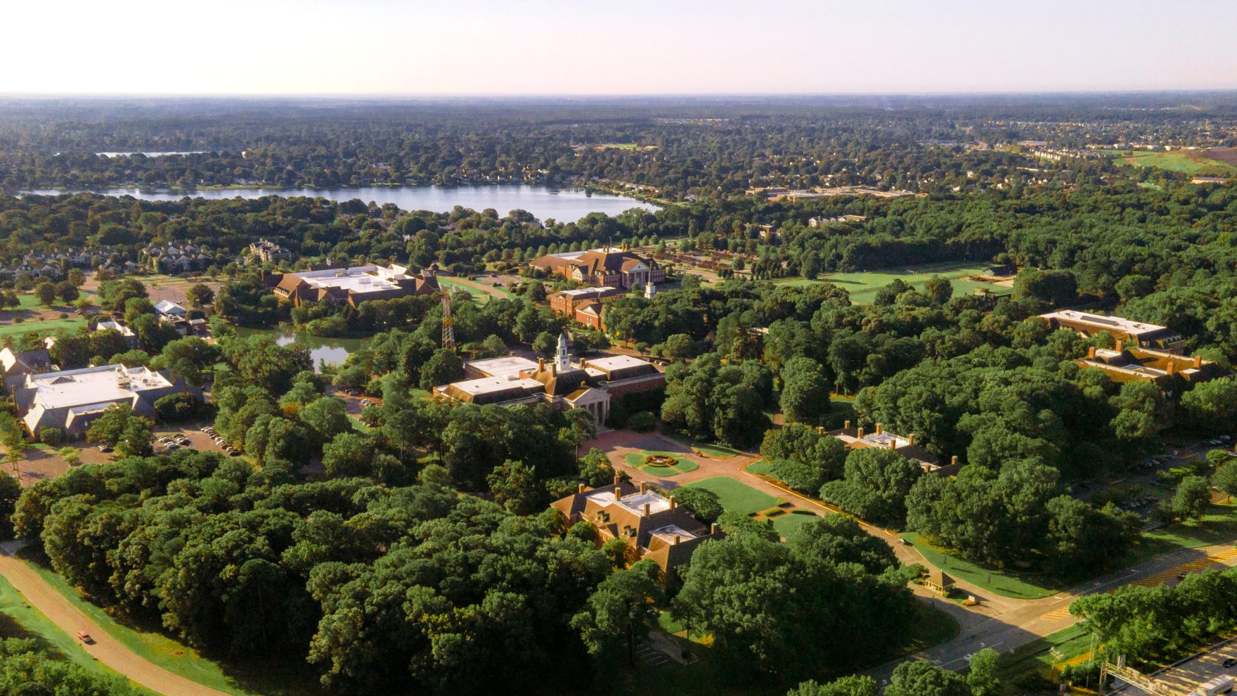 Wide shot of Regent University's campus and surrounding trees, located in Virginia Beach, Virginia.